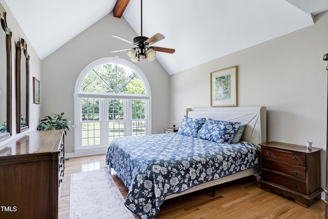 2709 Les Paul Ln, Apex, NC 27539 - bedroom featuring beamed ceiling, light wood-style flooring, high vaulted ceiling, and a ceiling fan