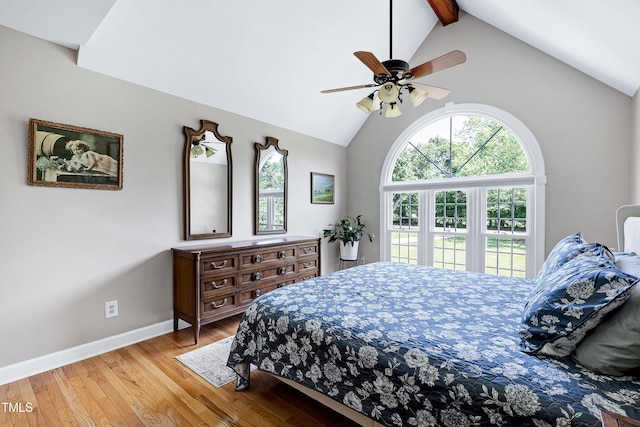 2709 Les Paul Ln, Apex, NC 27539 - bedroom with light wood-style floors, beamed ceiling, baseboards, high vaulted ceiling, and ceiling fan