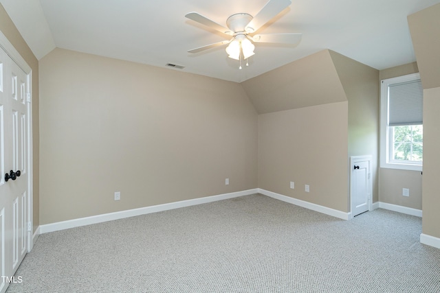 2709 Les Paul Ln, Apex, NC 27539 - additional living space with lofted ceiling, light carpet, ceiling fan, and baseboards
