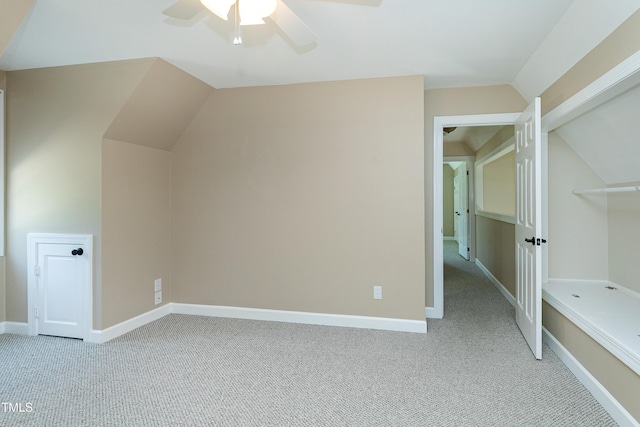 2709 Les Paul Ln, Apex, NC 27539 - additional living space with light colored carpet, a ceiling fan, lofted ceiling, and baseboards