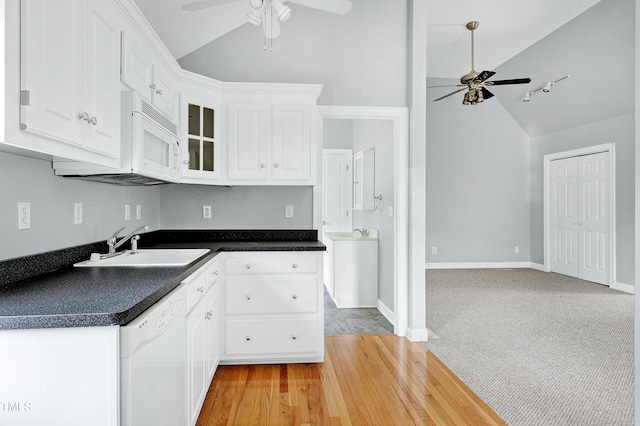2709 Les Paul Ln, Apex, NC 27539 - kitchen with ceiling fan, white appliances, dark countertops, white cabinetry, and high vaulted ceiling