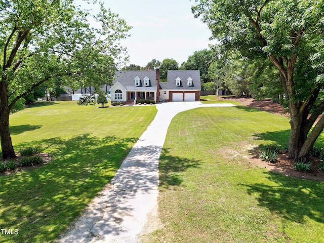 2709 Les Paul Ln, Apex, NC 27539 - new england style home with driveway, an attached garage, and a front yard