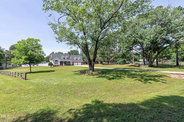 2709 Les Paul Ln, Apex, NC 27539 - view of yard with a garage and driveway