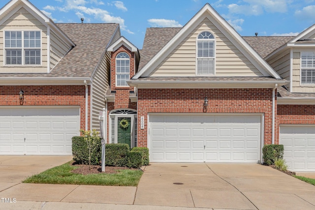 8004 Thrush Ridge Ln, Raleigh, NC 27615 - traditional home with brick siding, driveway, and roof with shingles