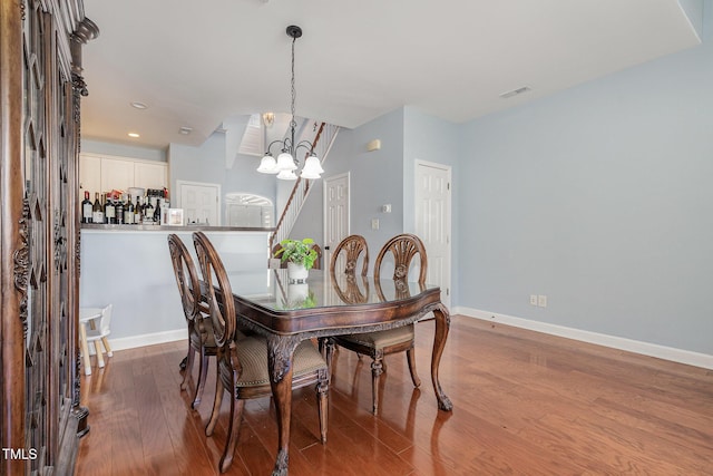 8004 Thrush Ridge Ln, Raleigh, NC 27615 - dining room with a chandelier, wood finished floors, and recessed lighting