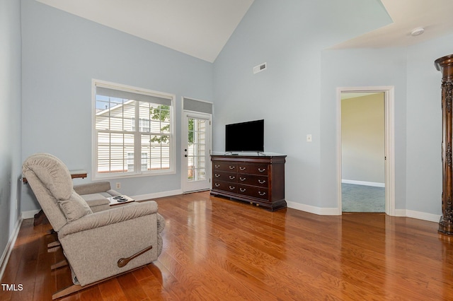 8004 Thrush Ridge Ln, Raleigh, NC 27615 - sitting room featuring wood finished floors and high vaulted ceiling