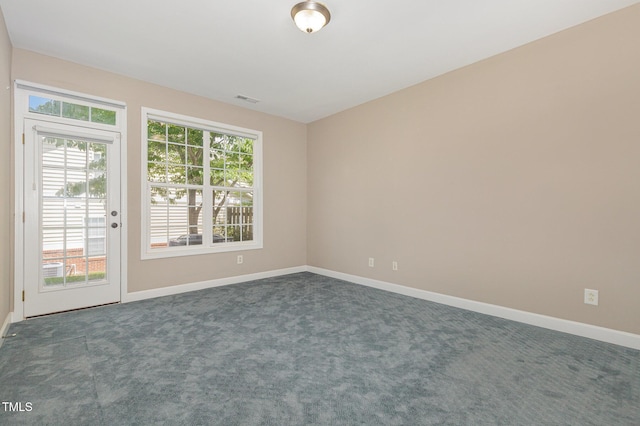 8004 Thrush Ridge Ln, Raleigh, NC 27615 - unfurnished room with dark colored carpet and baseboards