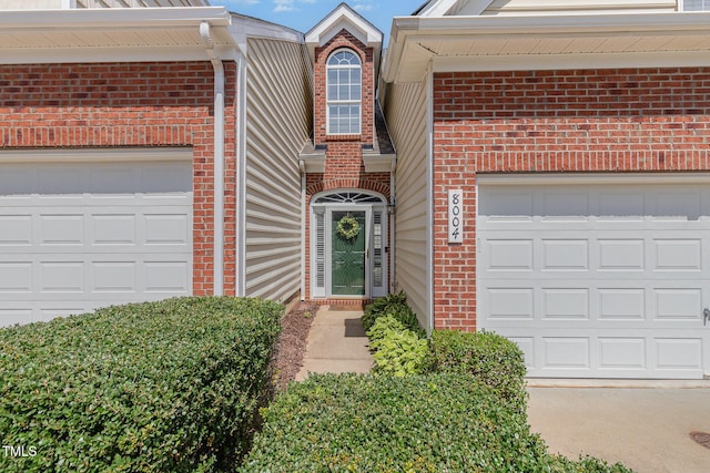 8004 Thrush Ridge Ln, Raleigh, NC 27615 - view of front facade featuring brick siding, driveway, and a garage