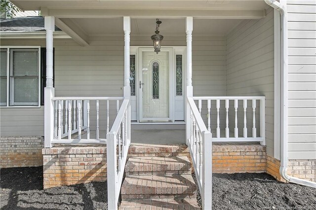994 Eastman Rd, Fayetteville, NC 28314 - doorway to property featuring a porch