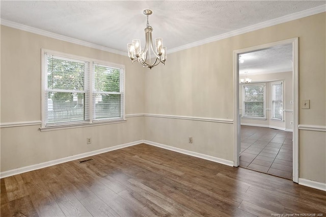 994 Eastman Rd, Fayetteville, NC 28314 - spare room with a chandelier, plenty of natural light, wood finished floors, ornamental molding, and baseboards