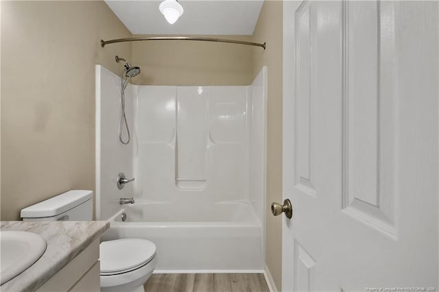 994 Eastman Rd, Fayetteville, NC 28314 - bathroom with toilet, vanity, wood finished floors, and  shower combination