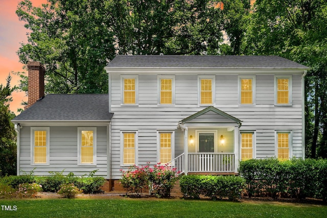 2107 Somers Ave, Burlington, NC 27215 - colonial-style house featuring a chimney and a shingled roof