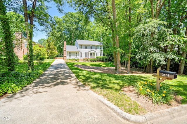 2107 Somers Ave, Burlington, NC 27215 - colonial home with a front yard and a chimney