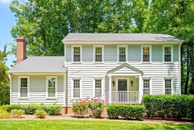 2107 Somers Ave, Burlington, NC 27215 - colonial inspired home featuring a shingled roof and a chimney