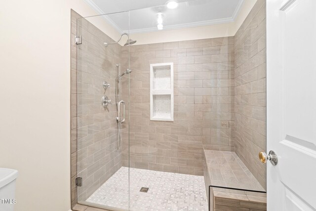 2107 Somers Ave, Burlington, NC 27215 - bathroom featuring crown molding, a shower stall, and toilet