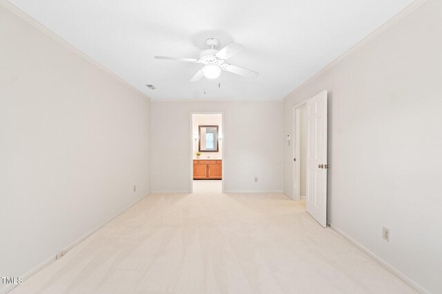 2107 Somers Ave, Burlington, NC 27215 - spare room featuring crown molding, a ceiling fan, light colored carpet, and baseboards