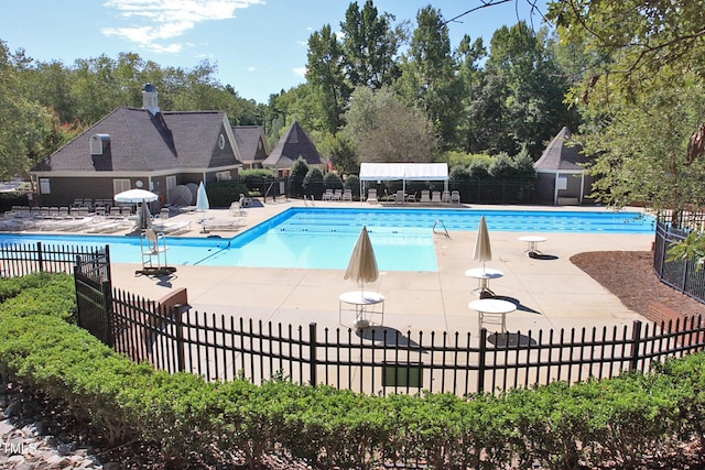 108 Ripplewater Ln, Cary, NC 27518 - community pool featuring a patio and view of scattered trees