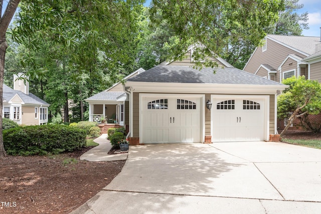 108 Ripplewater Ln, Cary, NC 27518 - view of front facade with a shingled roof, driveway, covered porch, and an attached garage