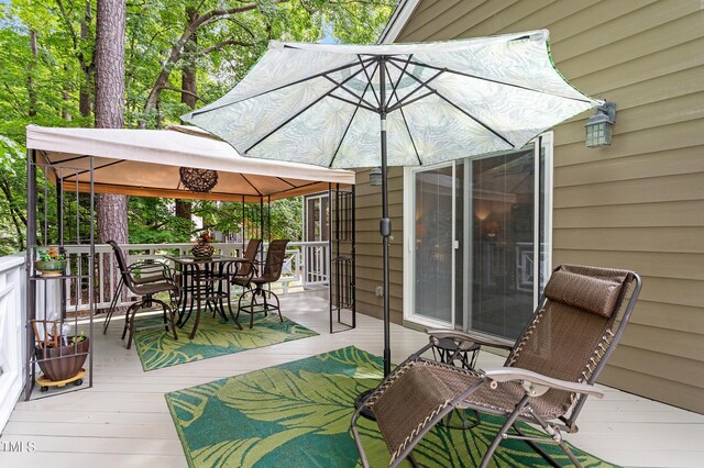 108 Ripplewater Ln, Cary, NC 27518 - wooden deck featuring a gazebo and outdoor dining space