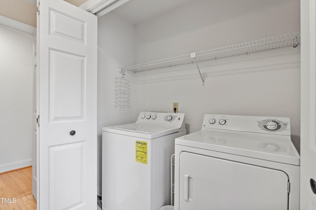 108 Ripplewater Ln, Cary, NC 27518 - laundry area with washing machine and clothes dryer and light wood-style floors