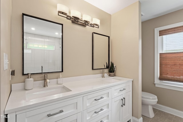 108 Ripplewater Ln, Cary, NC 27518 - bathroom featuring toilet, double vanity, a stall shower, and baseboards
