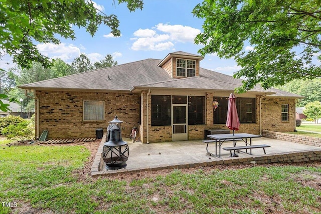 46 Spring Haven Ln, Willow Springs, NC 27592 - back of house with brick siding, a patio area, and a lawn