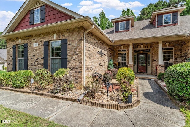 46 Spring Haven Ln, Willow Springs, NC 27592 - property entrance with brick siding, covered porch, and roof with shingles