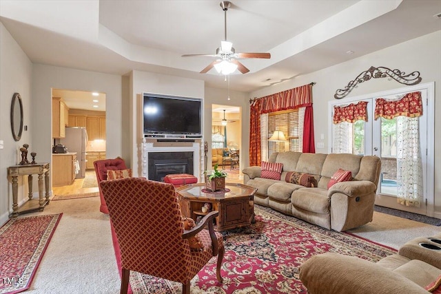 46 Spring Haven Ln, Willow Springs, NC 27592 - living area featuring a ceiling fan, baseboards, light colored carpet, and a raised ceiling