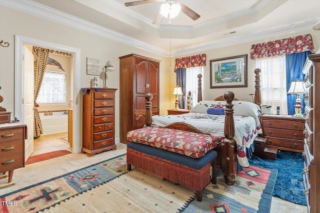 46 Spring Haven Ln, Willow Springs, NC 27592 - bedroom featuring crown molding, a tray ceiling, light colored carpet, ensuite bath, and ceiling fan