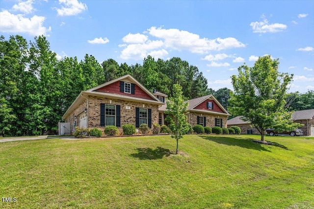 46 Spring Haven Ln, Willow Springs, NC 27592 - view of front of property with an attached garage, a front yard, and brick siding