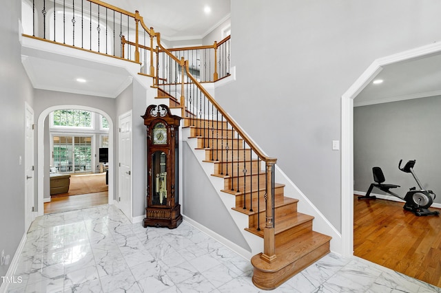 225 Midenhall Way, Cary, NC 27513 - staircase with marble finish floors, a towering ceiling, baseboards, recessed lighting, and ornamental molding