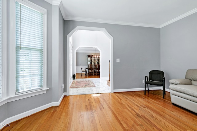 225 Midenhall Way, Cary, NC 27513 - sitting room featuring light wood-style flooring, ornamental molding, arched walkways, and baseboards