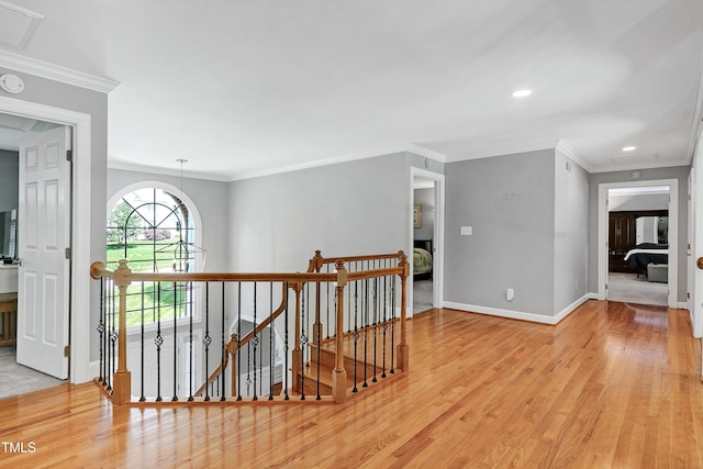 225 Midenhall Way, Cary, NC 27513 - hallway featuring an upstairs landing, wood finished floors, baseboards, recessed lighting, and crown molding