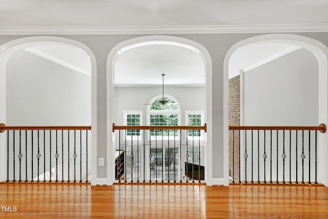 225 Midenhall Way, Cary, NC 27513 - hallway with wood finished floors, crown molding, and arched walkways