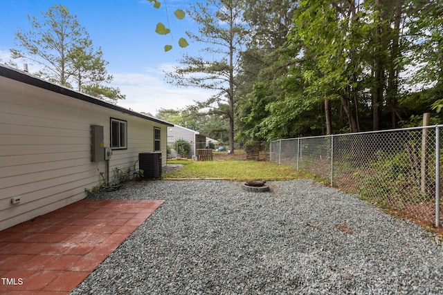 1204 Pecan Pl, Durham, NC 27704 - view of yard featuring central AC and a fire pit