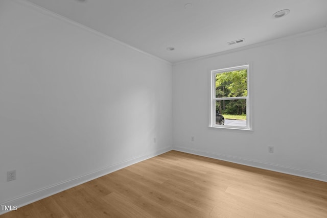 1204 Pecan Pl, Durham, NC 27704 - unfurnished room featuring light wood-style flooring, crown molding, and baseboards
