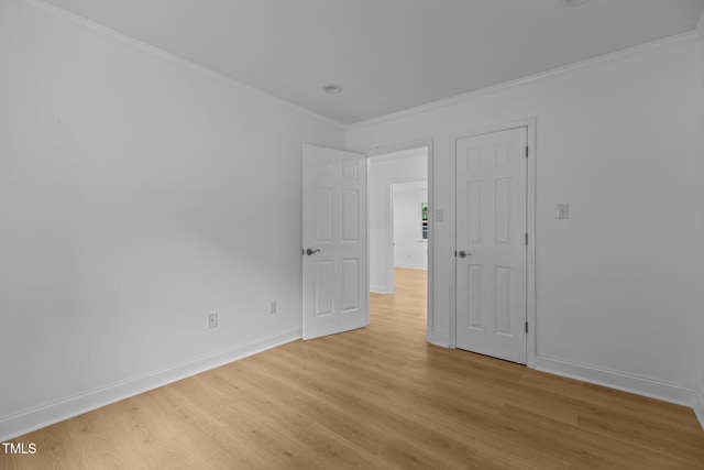 1204 Pecan Pl, Durham, NC 27704 - empty room with light wood-type flooring, crown molding, and baseboards