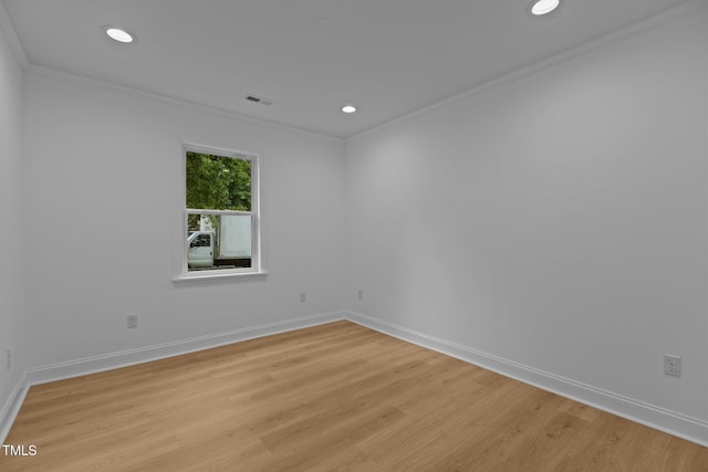 1204 Pecan Pl, Durham, NC 27704 - empty room with ornamental molding, light wood-style flooring, baseboards, and recessed lighting