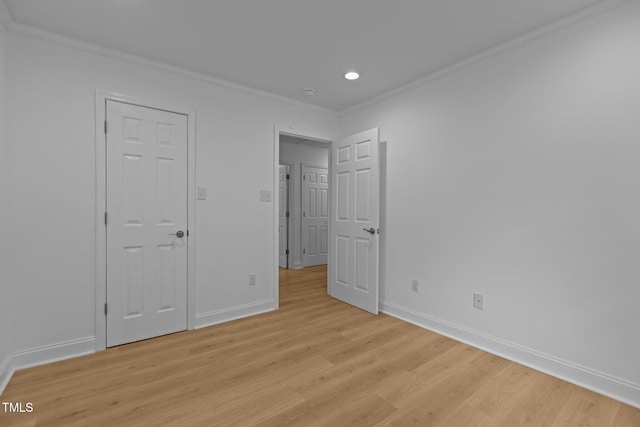 1204 Pecan Pl, Durham, NC 27704 - unfurnished bedroom with light wood finished floors, baseboards, crown molding, and recessed lighting
