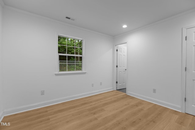 1204 Pecan Pl, Durham, NC 27704 - spare room featuring light wood finished floors, crown molding, baseboards, and recessed lighting