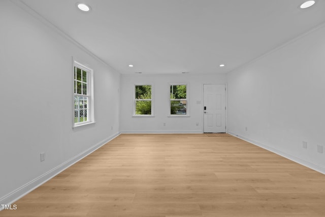 1204 Pecan Pl, Durham, NC 27704 - spare room featuring crown molding, recessed lighting, baseboards, and light wood-style floors