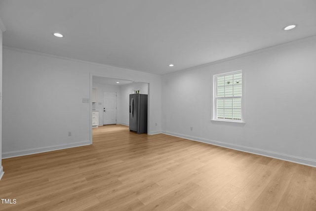 1204 Pecan Pl, Durham, NC 27704 - unfurnished room with crown molding, recessed lighting, baseboards, and light wood-style floors