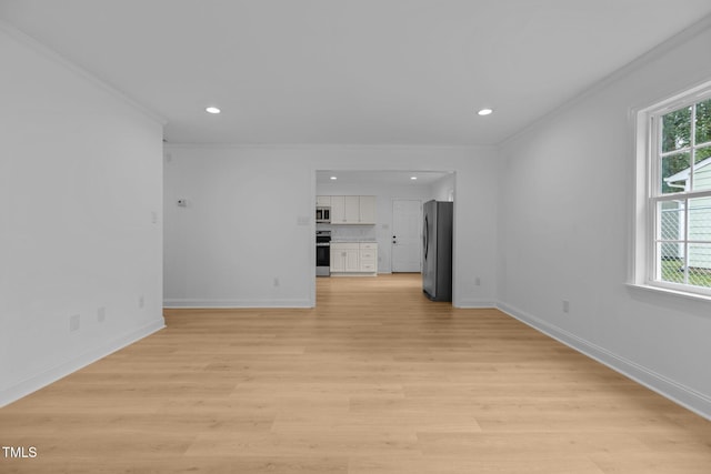 1204 Pecan Pl, Durham, NC 27704 - unfurnished living room with plenty of natural light, recessed lighting, light wood-type flooring, baseboards, and ornamental molding