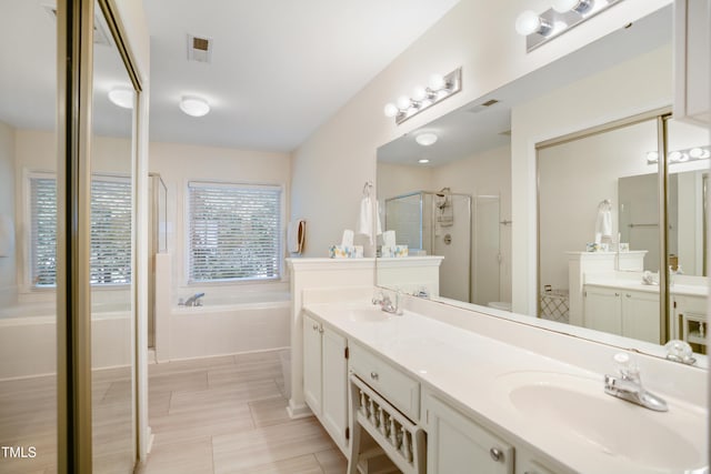 114 Colchis Ct, Cary, NC 27513 - full bath featuring a stall shower, a bath, double vanity, and tile patterned floors