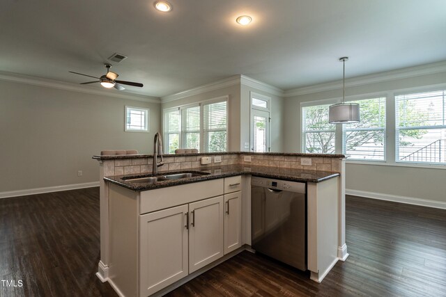 5638 Wade Park Blvd, Raleigh, NC 27607 - kitchen featuring stainless steel dishwasher, a sink, dark wood finished floors, a ceiling fan, and ornamental molding