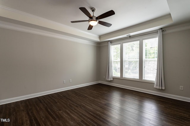 5638 Wade Park Blvd, Raleigh, NC 27607 - empty room featuring a raised ceiling, ceiling fan, dark wood-style floors, crown molding, and baseboards