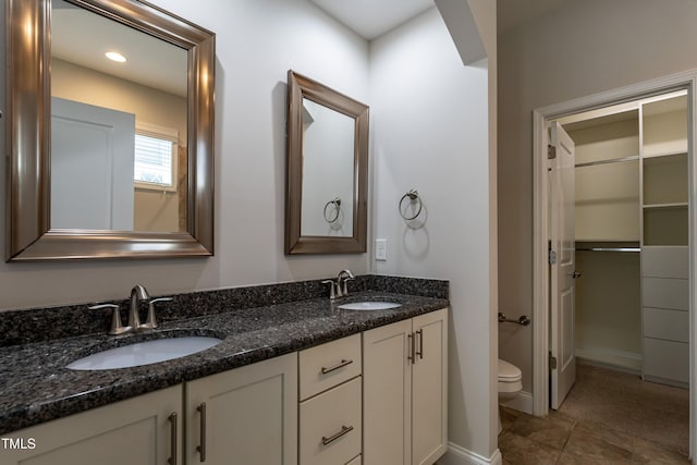 5638 Wade Park Blvd, Raleigh, NC 27607 - bathroom featuring toilet and double vanity