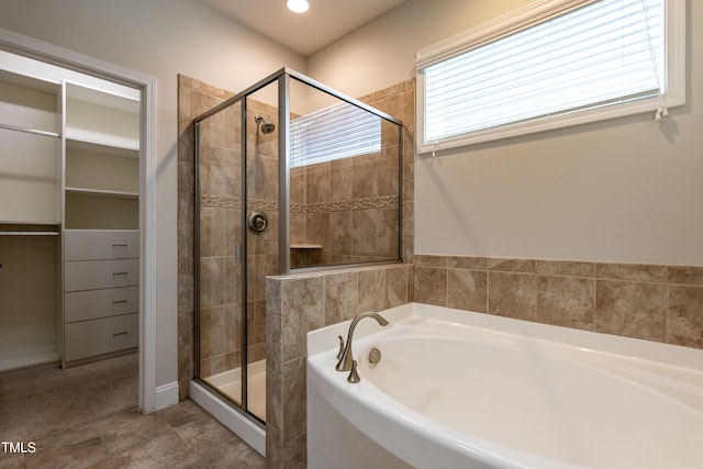 5638 Wade Park Blvd, Raleigh, NC 27607 - bathroom featuring a bath, a stall shower, a spacious closet, and recessed lighting