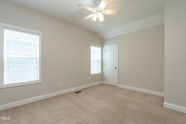 5638 Wade Park Blvd, Raleigh, NC 27607 - spare room featuring light carpet, baseboards, a ceiling fan, and lofted ceiling