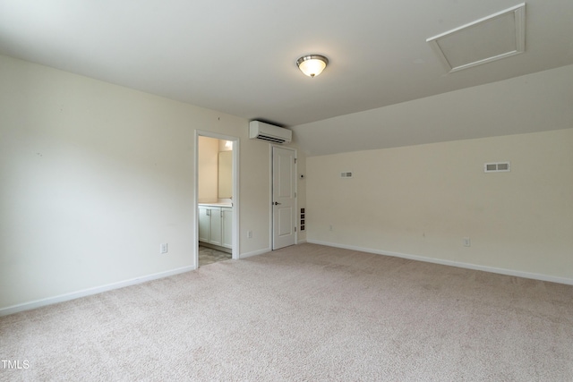 5638 Wade Park Blvd, Raleigh, NC 27607 - unfurnished room featuring an AC wall unit, light colored carpet, baseboards, and lofted ceiling